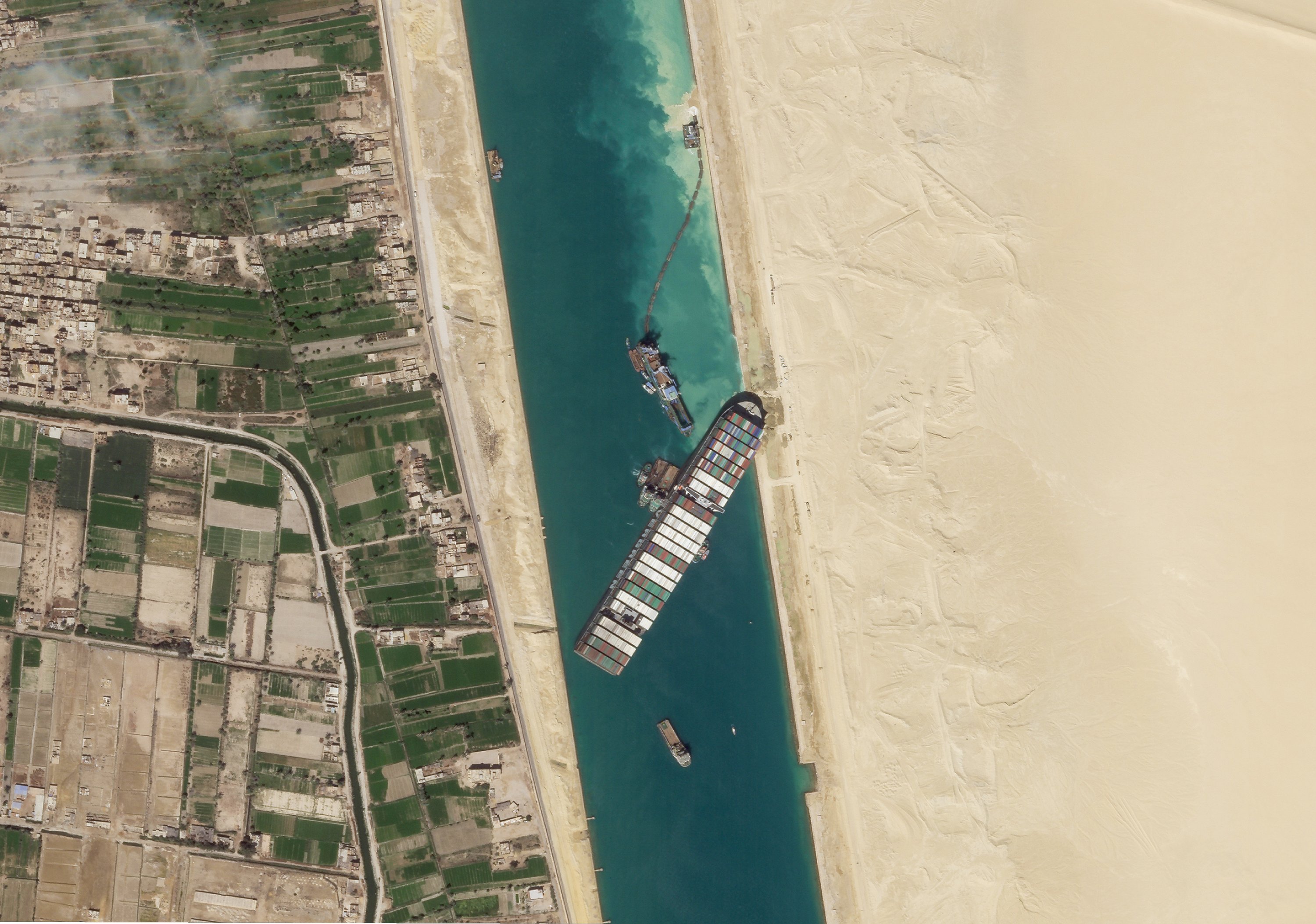 Giant container ship stuck in Suez Canal partially refloated in 1st step to unblock one of world’s busiest waterways